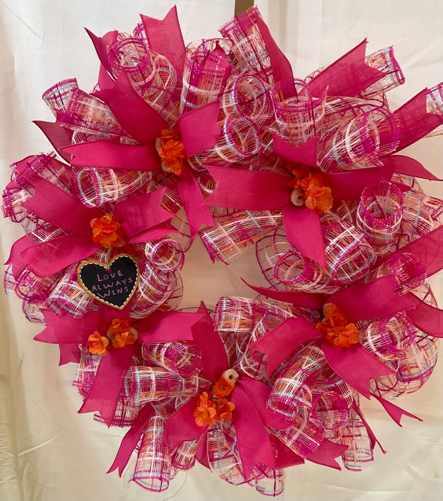 “Petals of Pride: A Wreath Where Love Always Wins”