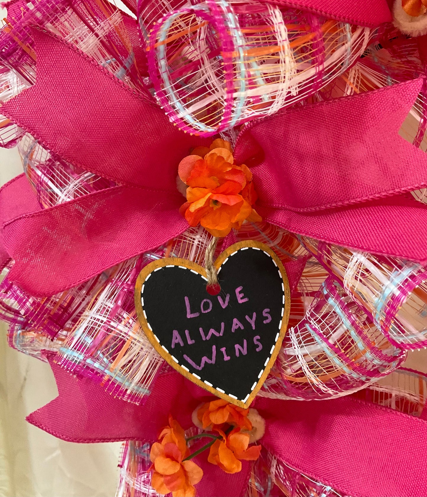 “Petals of Pride: A Wreath Where Love Always Wins”